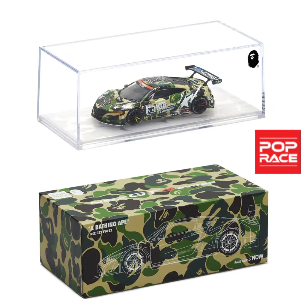 A 1:64 scale diecast model of a Honda NSX GT3 EVO22 in BAPE livery, displayed in a clear case with a camouflage patterned box packaging.