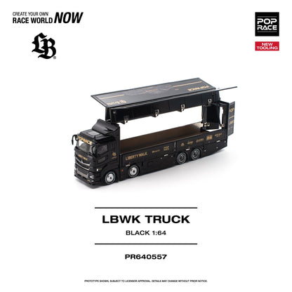 A 1:64 scale model of a black race truck with gold lettering, shown on a white background with branding and product text. The truck has its cargo bed open, revealing a brown interior.
