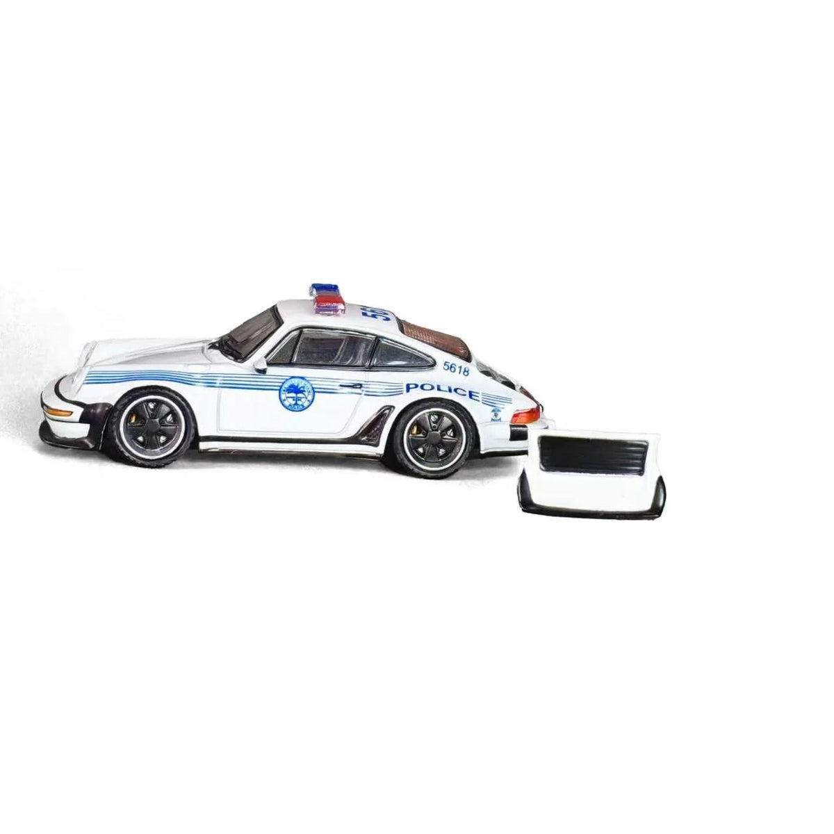 RHINO 1:64 Porsche 911 RWB 930 Miami Vice Police Car Diecast Model in White with Blue Police Stripes, Unit 5618, Red and Blue Roof Lights, Black Wheels and Detachable Rear Spoiler, Side View.