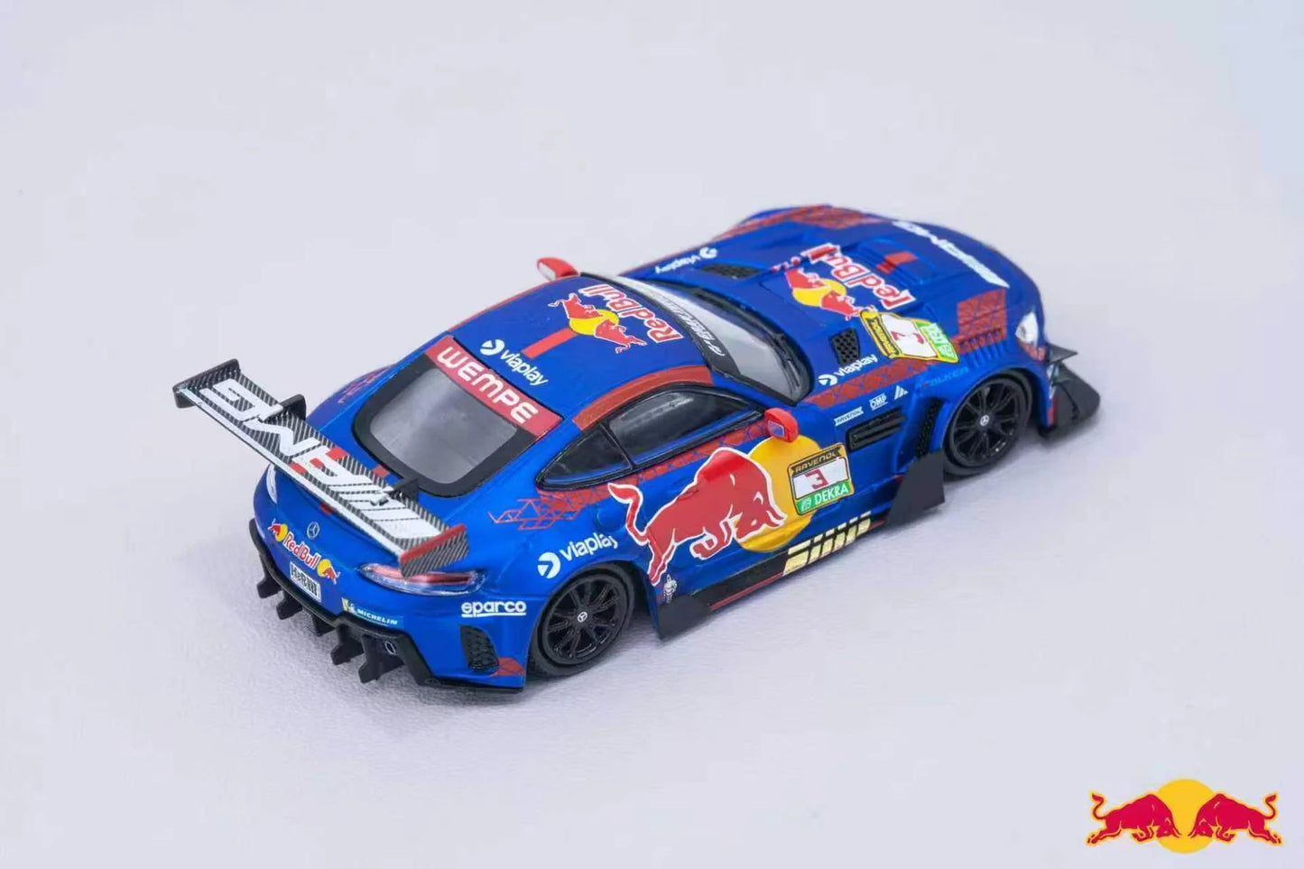 Model car with Red Bull Racing livery on a light gray background