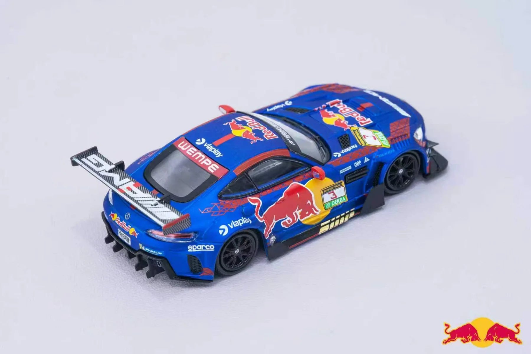 Model car with Red Bull Racing livery on a light gray background