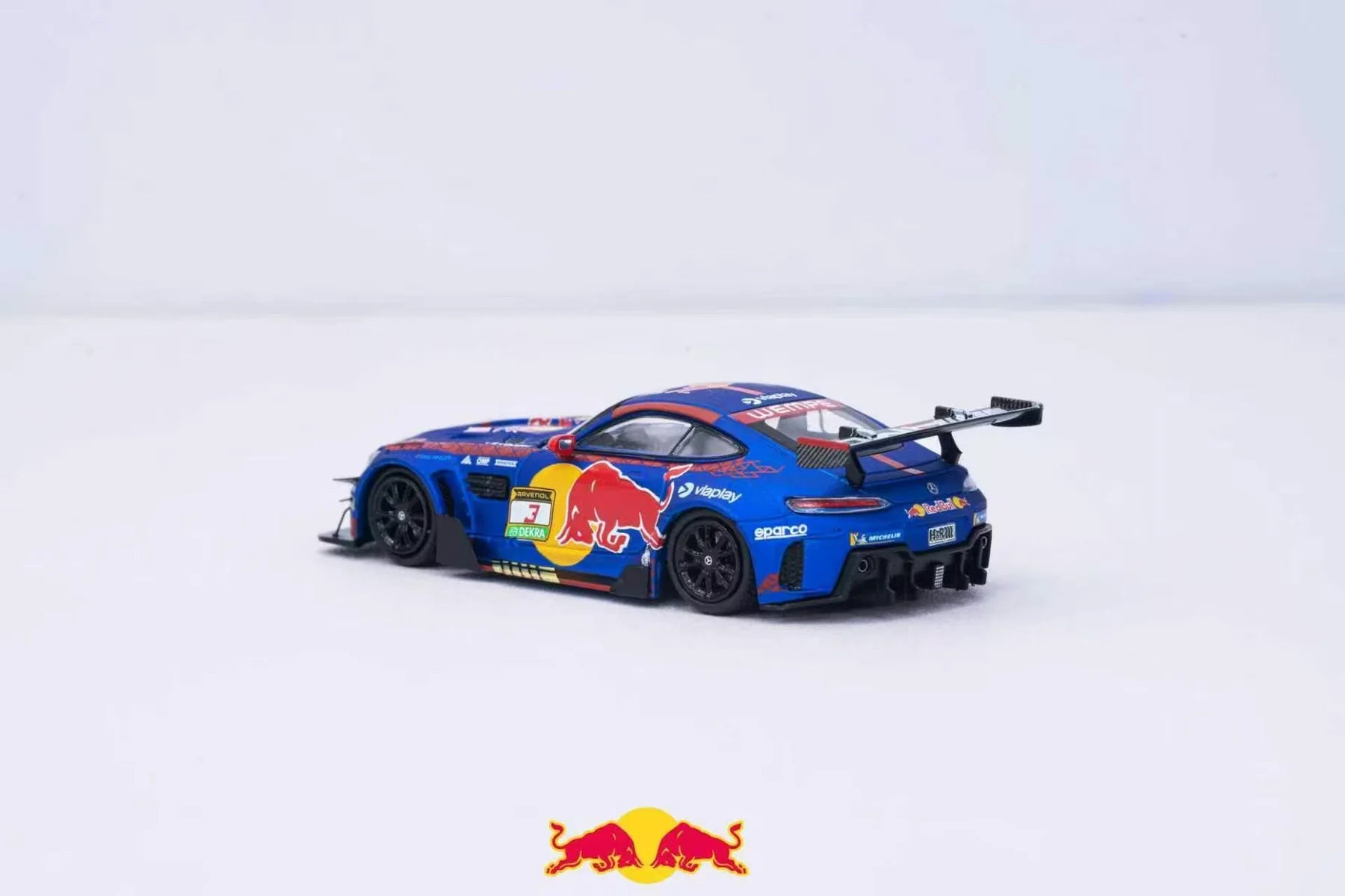 A blue Red Bull Racing Mercedes-AMG GT3 race car model with prominent Red Bull, Castore, and Mobil 1 logos, displayed on a clean white studio background.