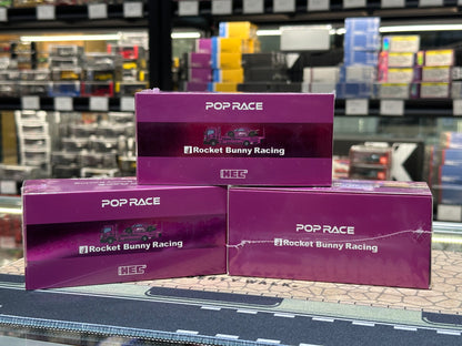 Three purple boxes with 'Pop Race' and 'Rocket Bunny Racing' branding on a reflective surface.
