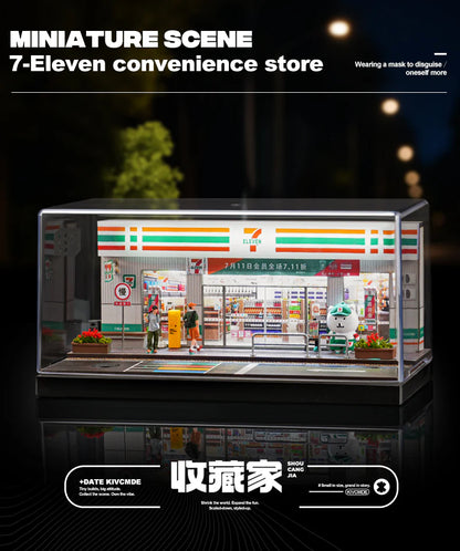 Miniature model of a 7-Eleven convenience store with people around it, set against a dark background.