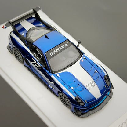 Blue and white sports car model on a gray background