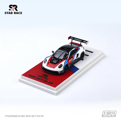 STAR RACE 1:64 Porsche 911 GT3 R #911 White Red and Blue Racing Livery Diecast Model Car High Angle Front Three Quarter View Displayed on Branded Base Featuring Black Racing Wheels, Carbon Fiber Hood and Large Rear Wing SR64056.