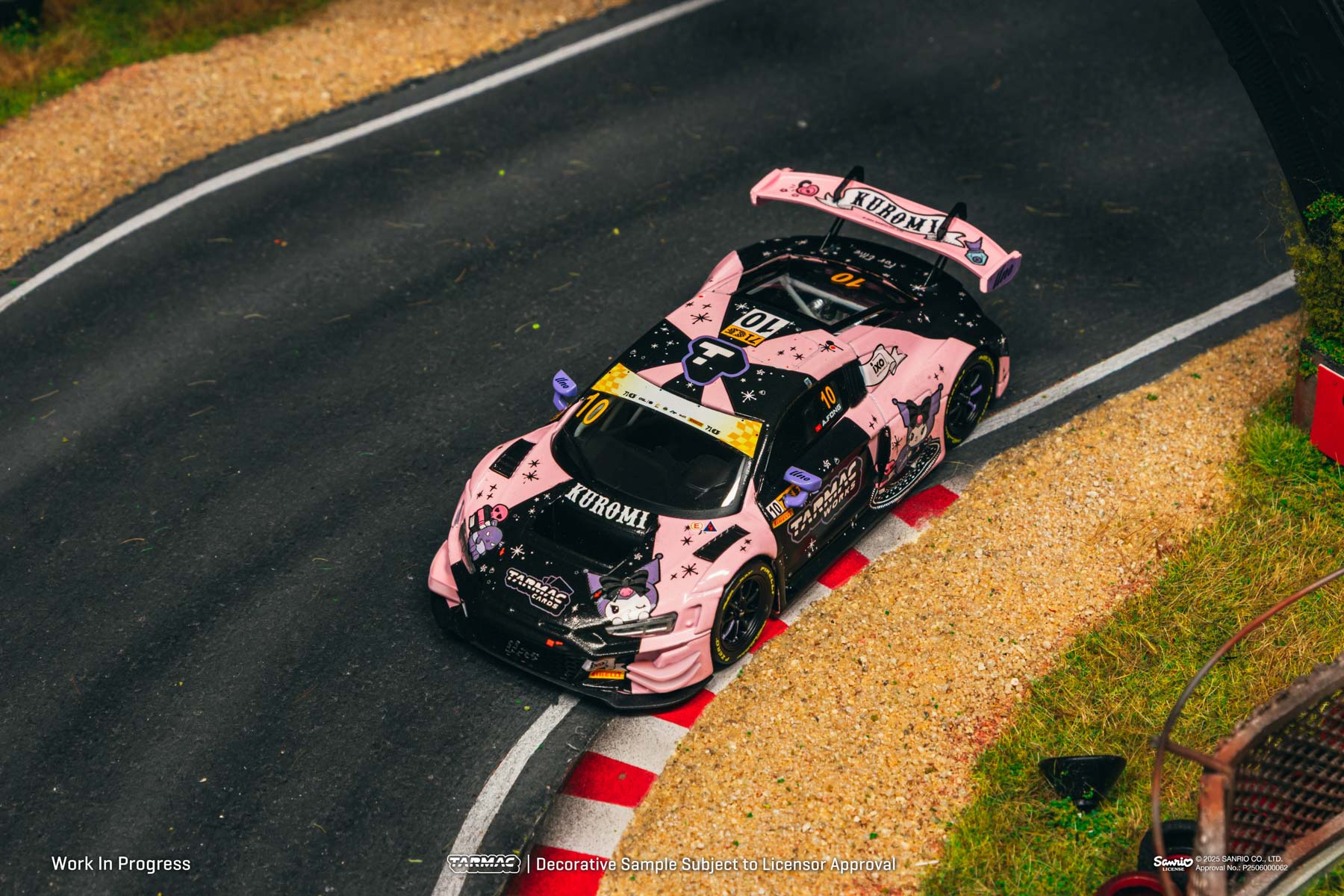 Pink and black race car on a track