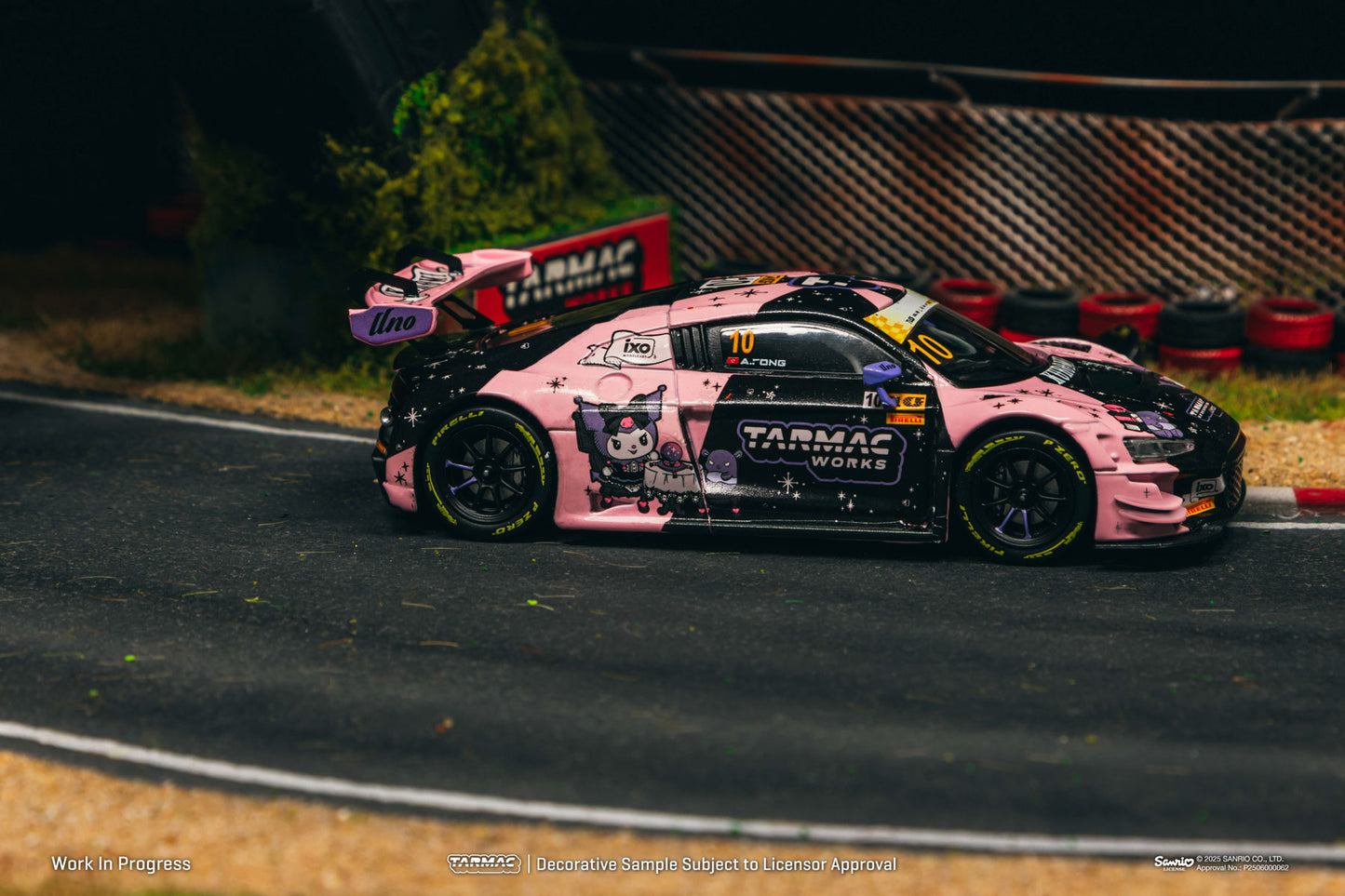 Pink model race car on a track with 'Tarmac Works' branding