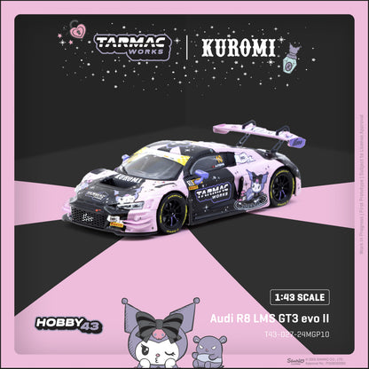 Model car of Audi R8 LMS GT3 evo II with Tarmac Works and Kuromi branding on a pink and black background.