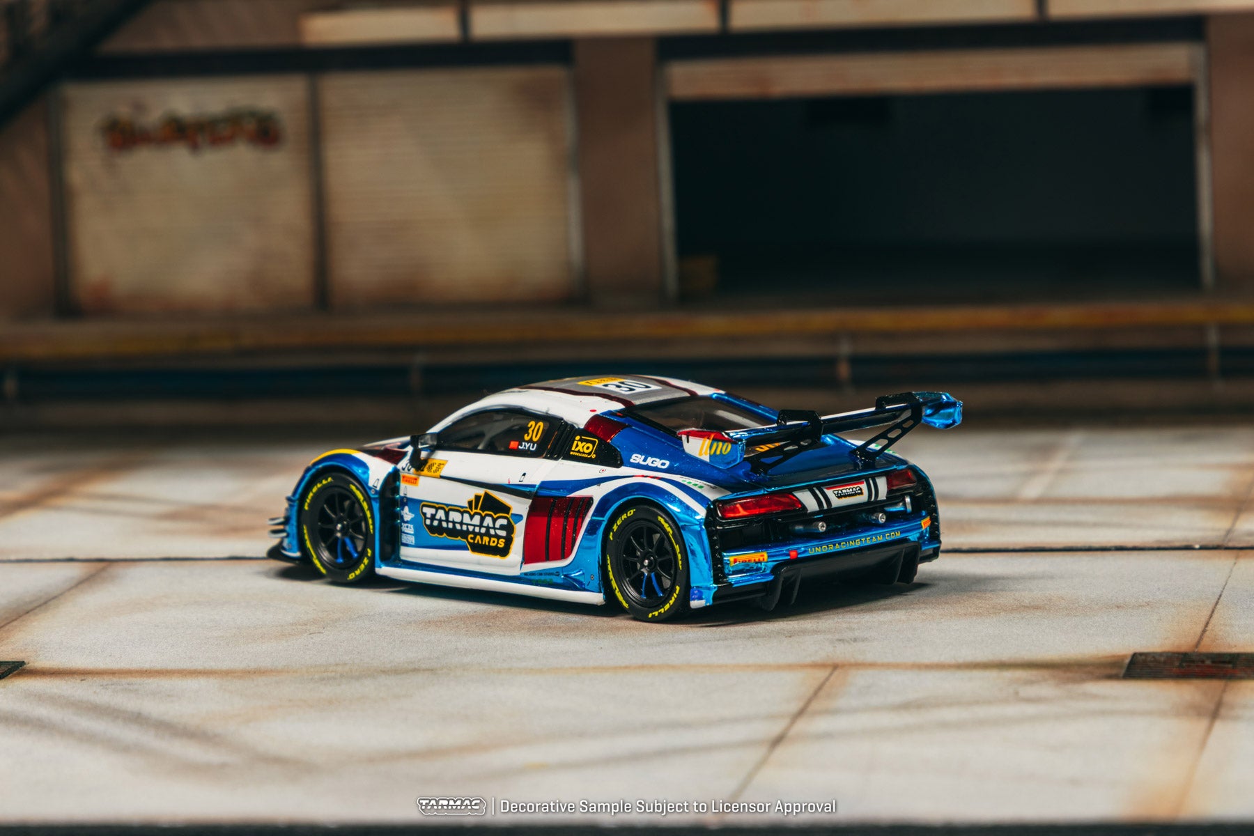 Model car on a wooden surface with a blurred background