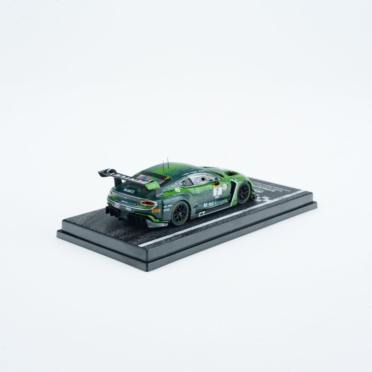 Model car on a display stand with a white background