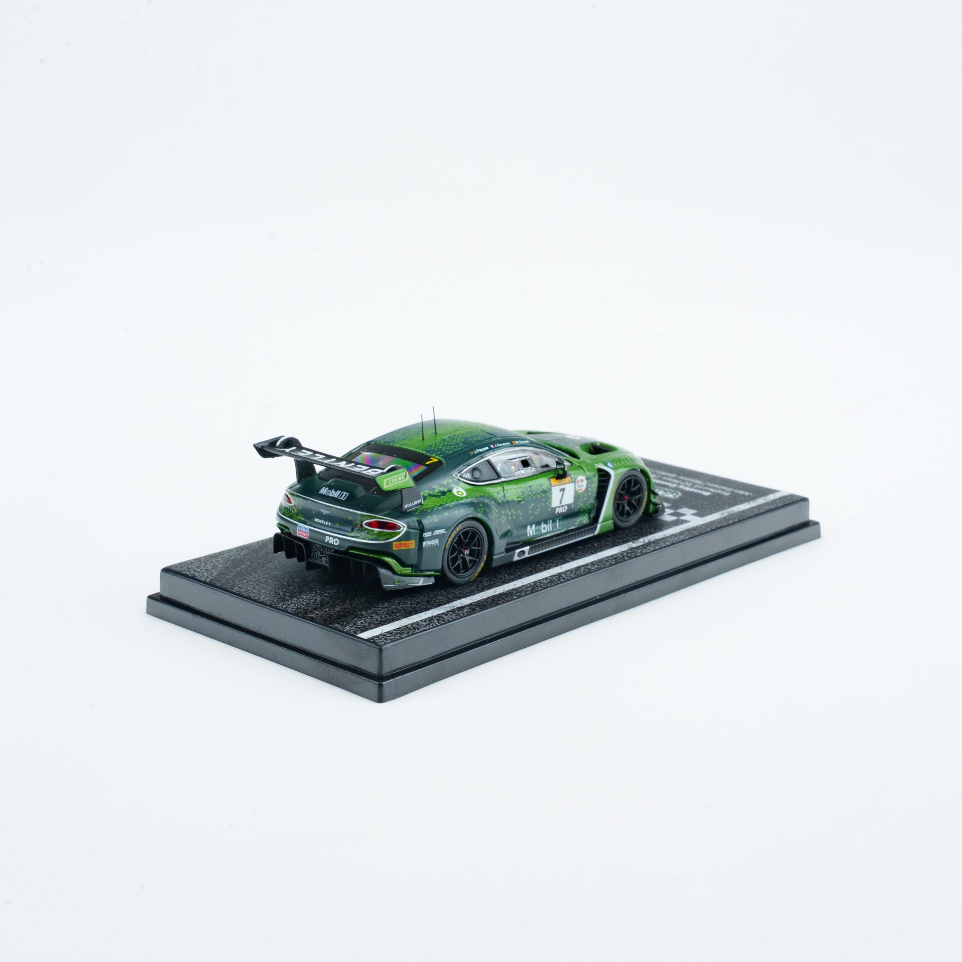 Model car on a display stand with a white background