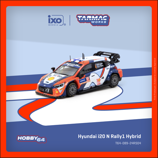 Model car of Hyundai i20 N Rally1 Hybrid on a blue and orange track with Ixo and Tarmac Works branding.