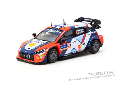 Model car of a rally vehicle with Shell and Hyundai logos on a white background