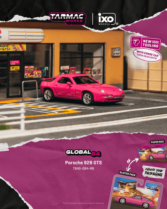 Model pink Porsche 928 GTS car on a street with Tarmac Works and IXO branding.