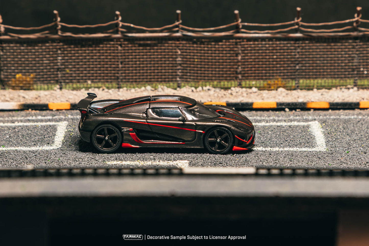 Model car on a miniature race track with a blurred background