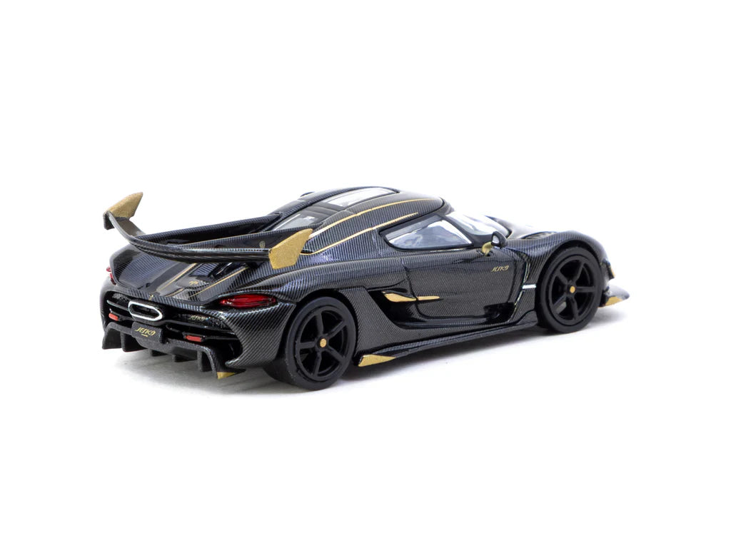 Black and gold sports car model on a white background