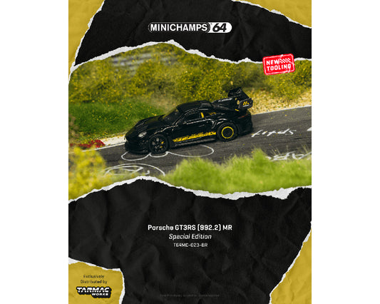 Model car of Porsche GT3 RS on a track with 'Minichamps' branding.