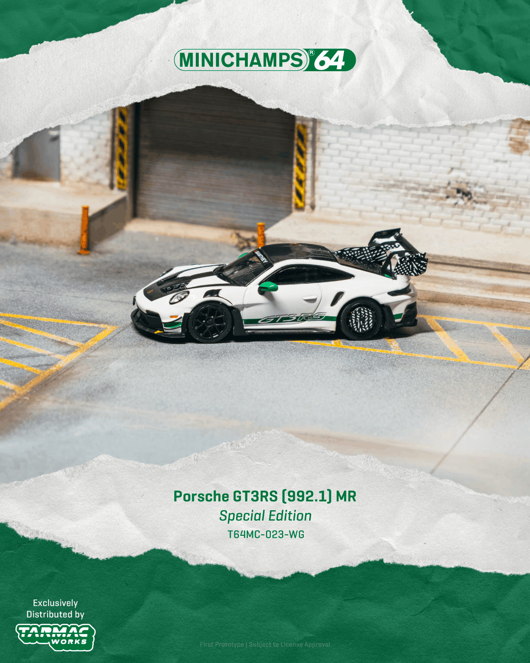A miniature model of a Porsche 911 GT3RS (992.1) MR Special Edition die-cast toy car, shown on a miniature racetrack with a garage backdrop.