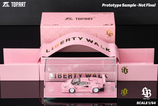 Pink model car in a transparent box with 'Liberty Walk' branding, on a black background.