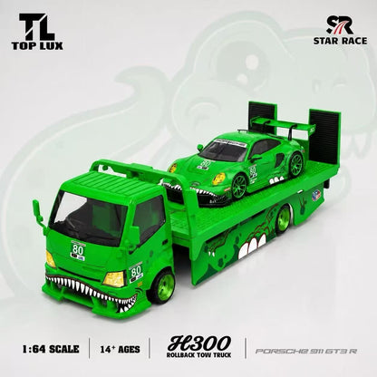 Green toy rollback tow truck and Porsche 911 GT3 R model car set, featuring a 1:64 scale design with shark mouth details and number 80, shown on a light gray background with brand logos.