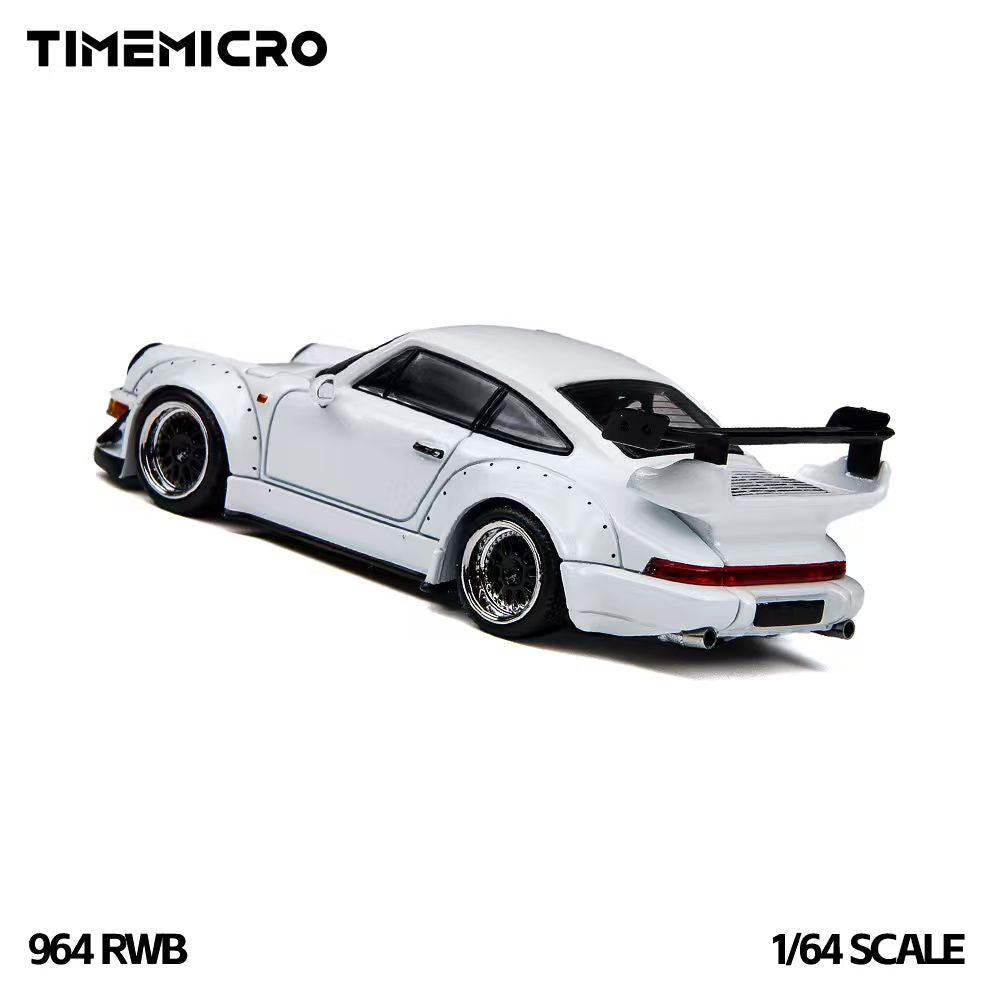 TIME MICRO 1:64 Porsche 911 964 RWB Rauh-Welt White diecast model TM648502, rear three-quarter view featuring white widebody fender flares, black multi-spoke wheels with polished rims, large rear wing, full-width red taillights, and dual exhaust tips.