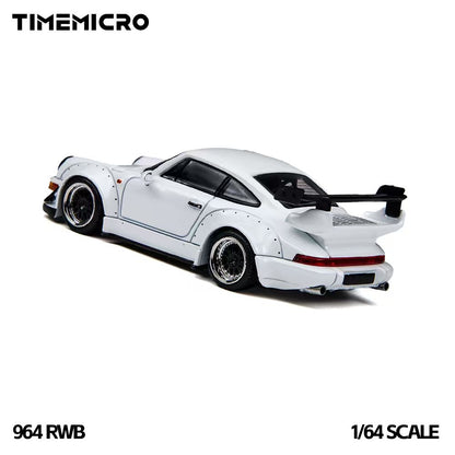 TIME MICRO 1:64 Porsche 911 964 RWB Rauh-Welt White diecast model TM648502, rear three-quarter view featuring white widebody fender flares, black multi-spoke wheels with polished rims, large rear wing, full-width red taillights, and dual exhaust tips.
