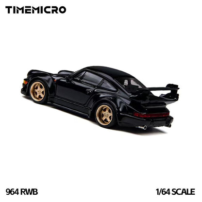 TIME MICRO 1:64 Porsche 911 964 RWB Rauh-Welt Black diecast model TM648503, rear three-quarter view featuring glossy black paint, gold five-spoke wheels, widebody fender flares, large rear wing, full-width red taillights, and dual exhaust tips.