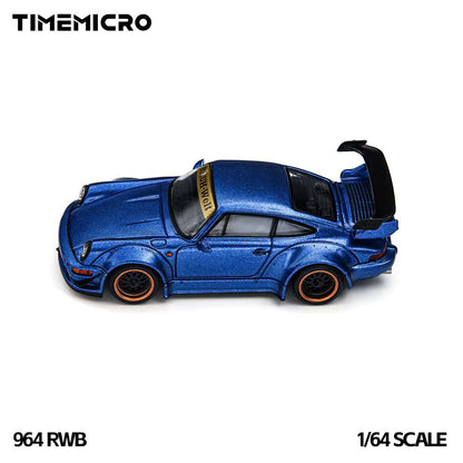 A blue metallic die-cast model car with an open rear trunk, shown on a plain white background. The brand name TIMEMICRO appears at the top left, and the text '964 RWB' and '1/64 SCALE' appear at the bottom.