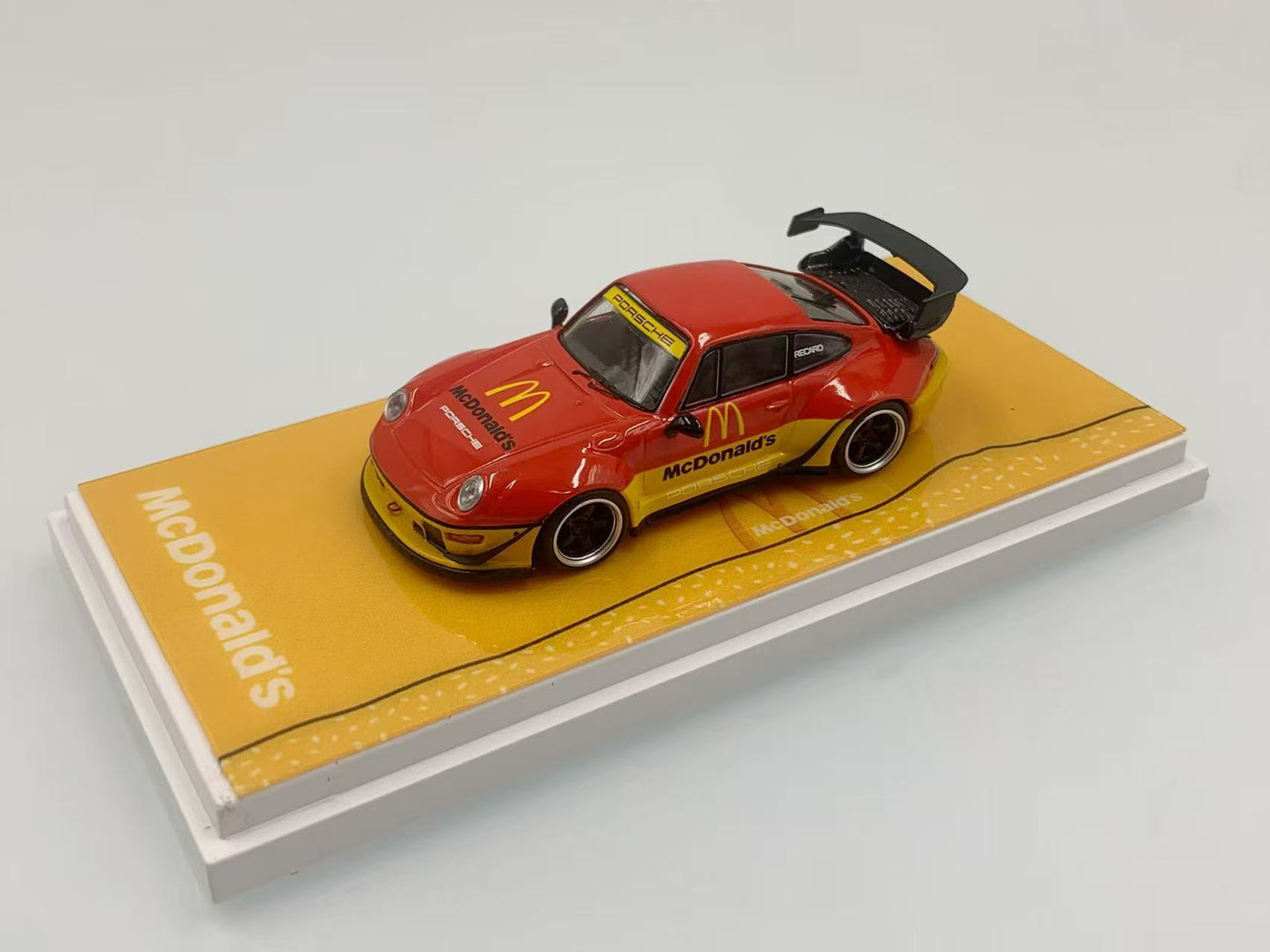 Model car on a McDonald's branded display stand with a white background