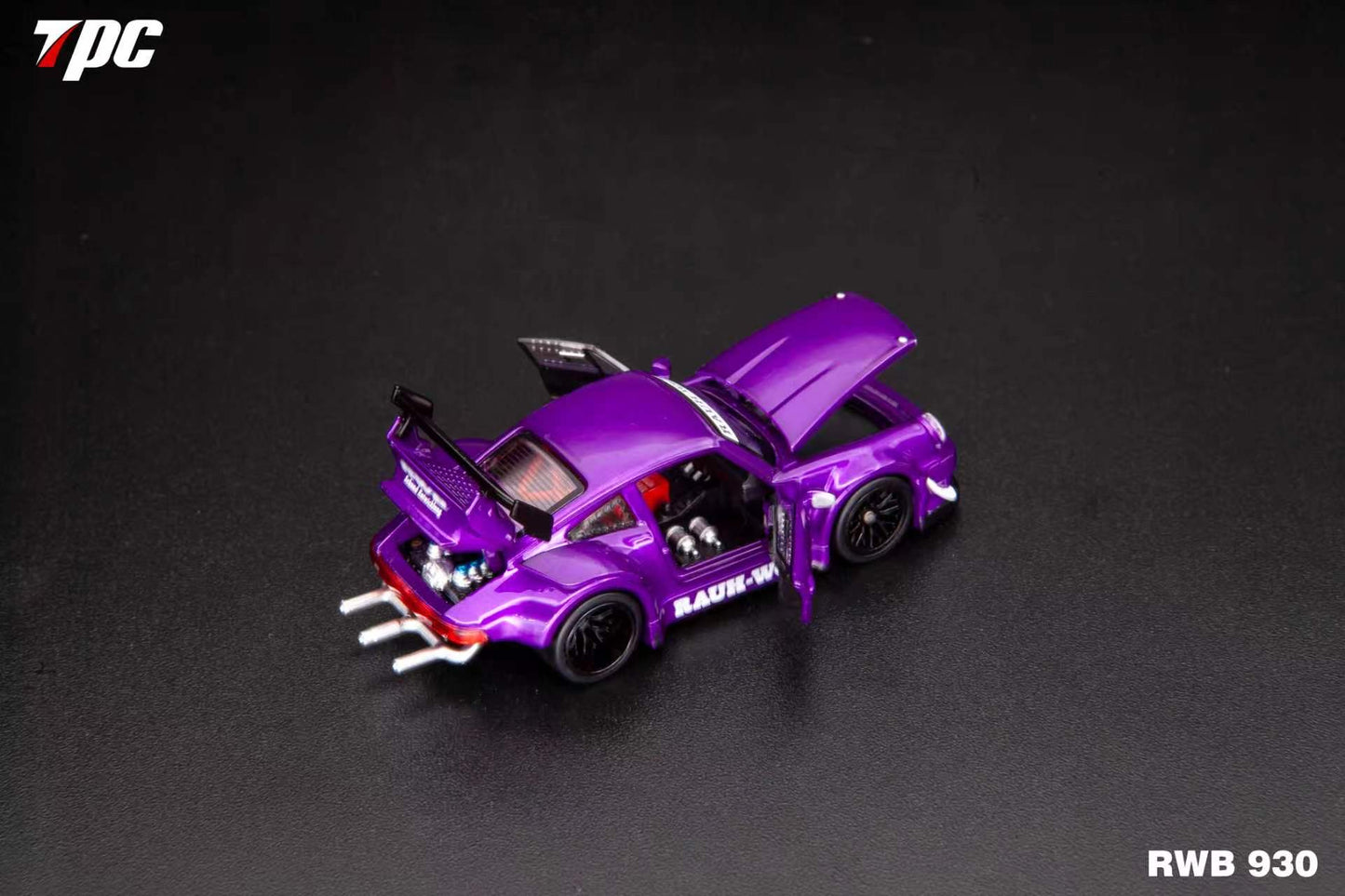 Purple toy car model on a dark background