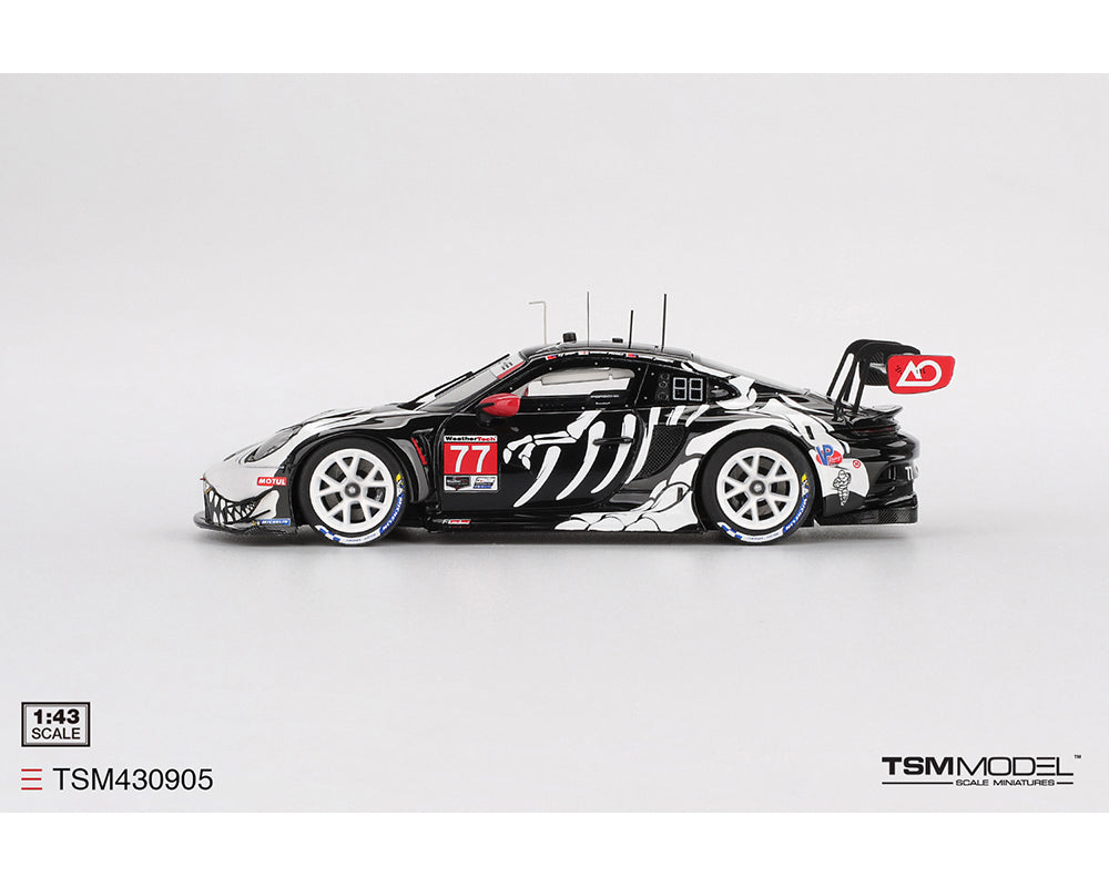 Model car with black and white design on a gray background, featuring TSM Model branding.