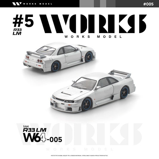 Works Model 1:64 Nissan Skyline GT-R R33 LM in metallic silver with dark blue wheels, aerodynamic widebody kit, vented hood, large rear wing, and race-inspired styling. Product code W64-005. Prototype diecast model shown from front and rear three-quarter views on a white background.