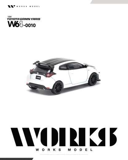 A white and black die-cast model car, a Toyota Gamin Yaris W640010, shown on a clean white background with 'WORKS MODEL' branding at the top and bottom.