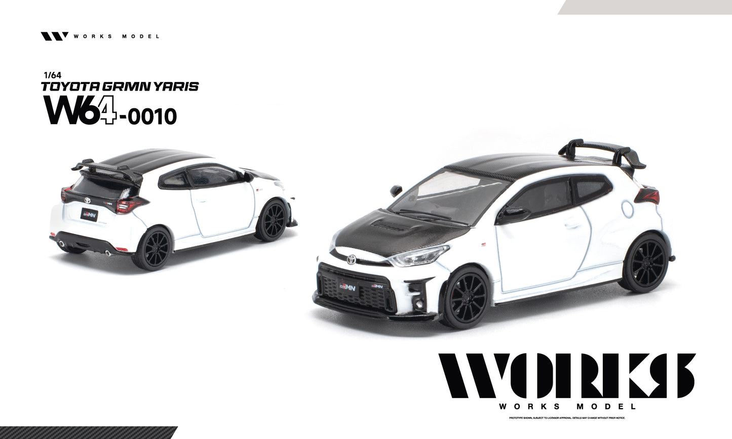 A 1/64 scale diecast model car of a white and black Toyota Gamin Yaris W640010, shown from both front-three-quarter and rear-three-quarter angles on a clean white background with WORKS MODEL branding.