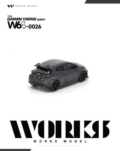 Works Model 1:64 Toyota GRMN Yaris Gray W64-0026 diecast model car rear view with carbon fiber roof, rear spoiler and black wheels