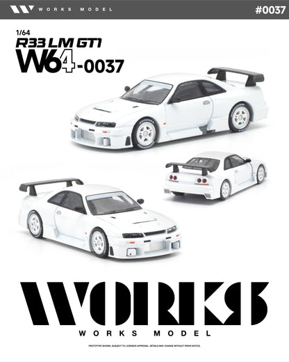 Works Model 1:64 Nissan Skyline GT-R R33 LM GT1 in factory white with white wheels, aerodynamic widebody, vented hood, front-mounted intercooler, and large GT-style rear wing. Product code W64-0037. Prototype diecast model shown from multiple angles.