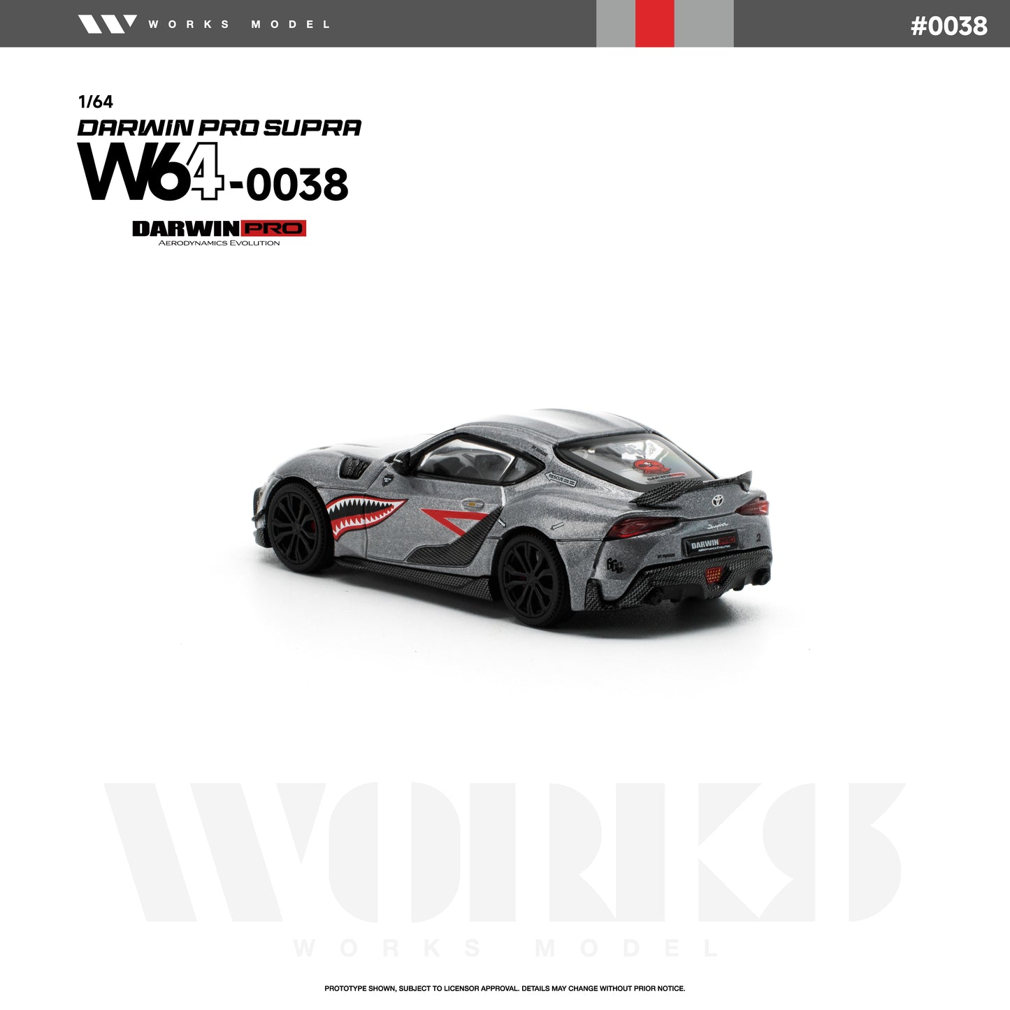 Rear three-quarter view of the Works Model 1:64 Toyota GR Supra DarwinPRO in metallic gray with shark mouth graphics, black wheels, carbon-style rear diffuser, aerodynamic body kit, and rear wing. Product code W64-0038. Prototype diecast model on a white background.