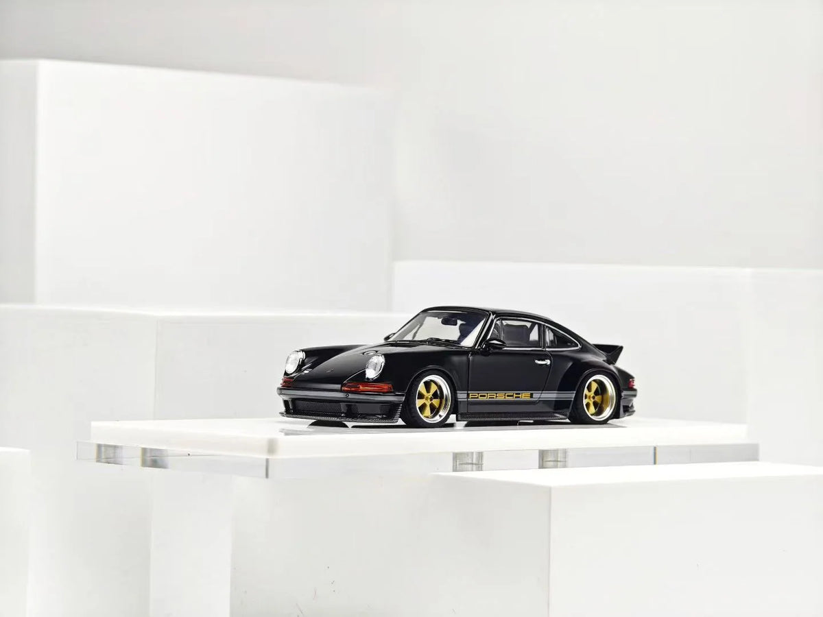 ZINCIT 1:64 Porsche 911 Singer DLS Black Diecast Model Car with Gold Wheels, Classic Porsche Side Stripes and Rear Spoiler – Front Side View