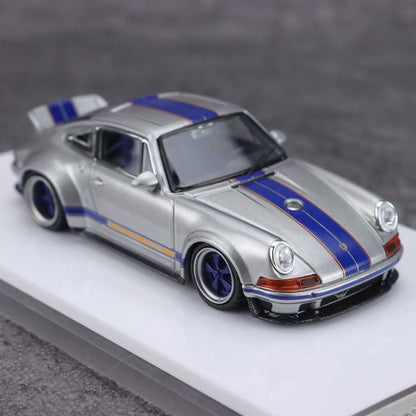Model car with blue stripes on a gray background