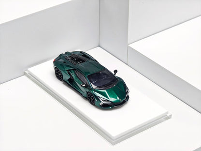 Green sports car model on a white platform