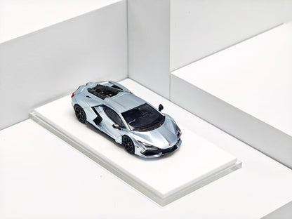 Model of a futuristic sports car on a white platform