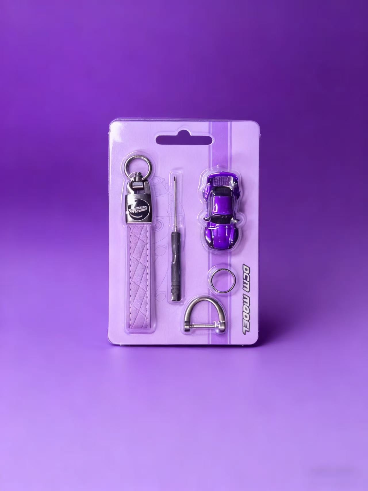Purple keychain set with tools on a purple background