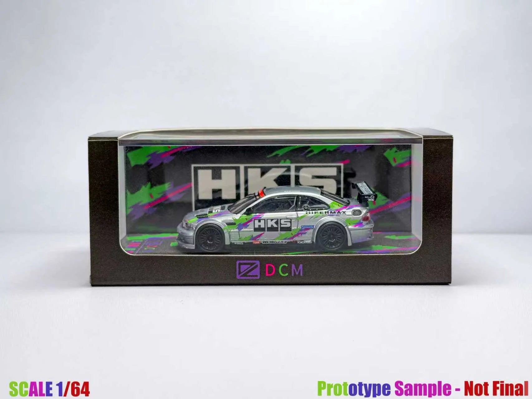 Model car in a transparent box with HKS branding on a white background