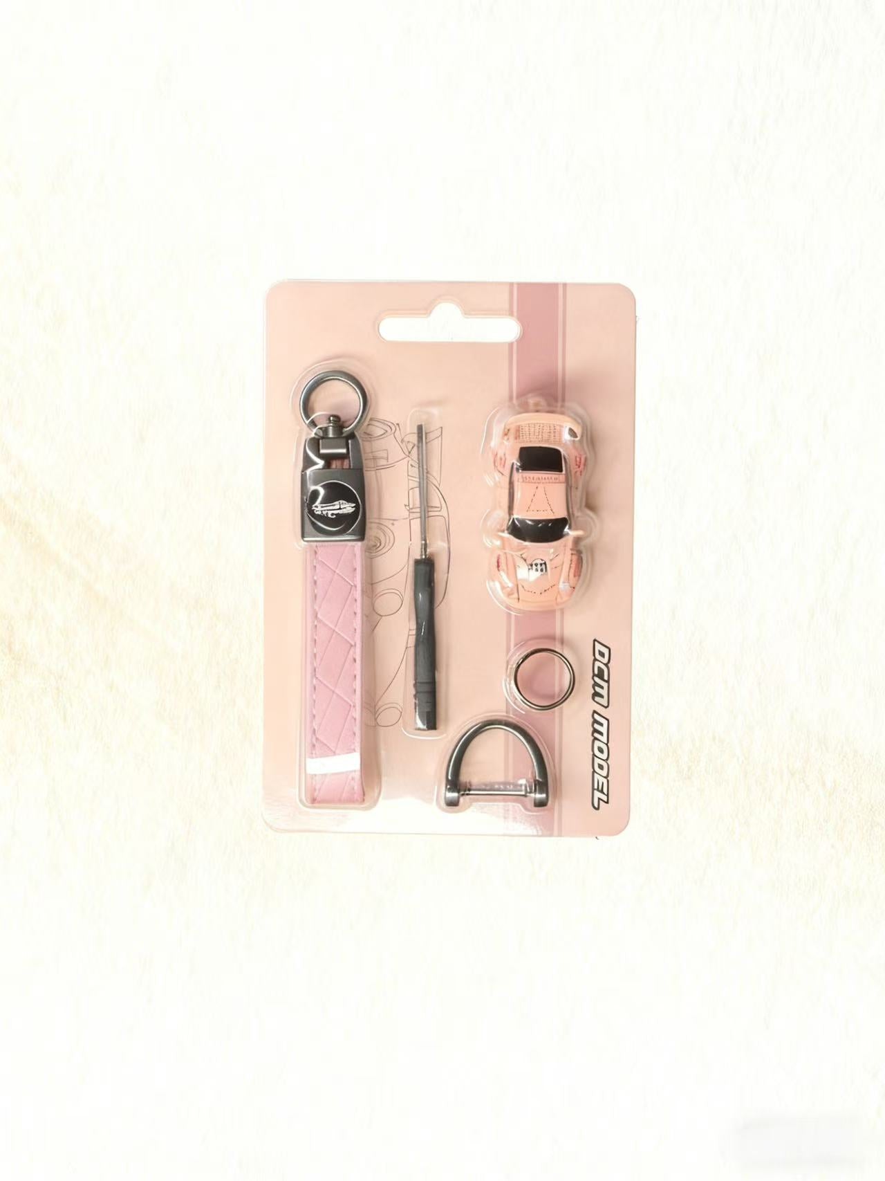 Set of pet accessories including a collar, leash, and tags on a pink card with 'Ferplast' branding.