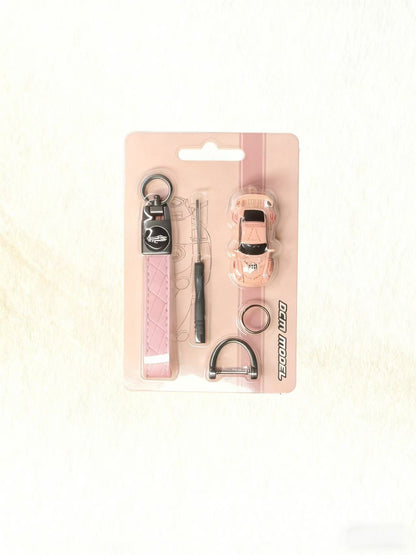 Set of pet accessories including a collar, leash, and tags on a pink card with 'Ferplast' branding.
