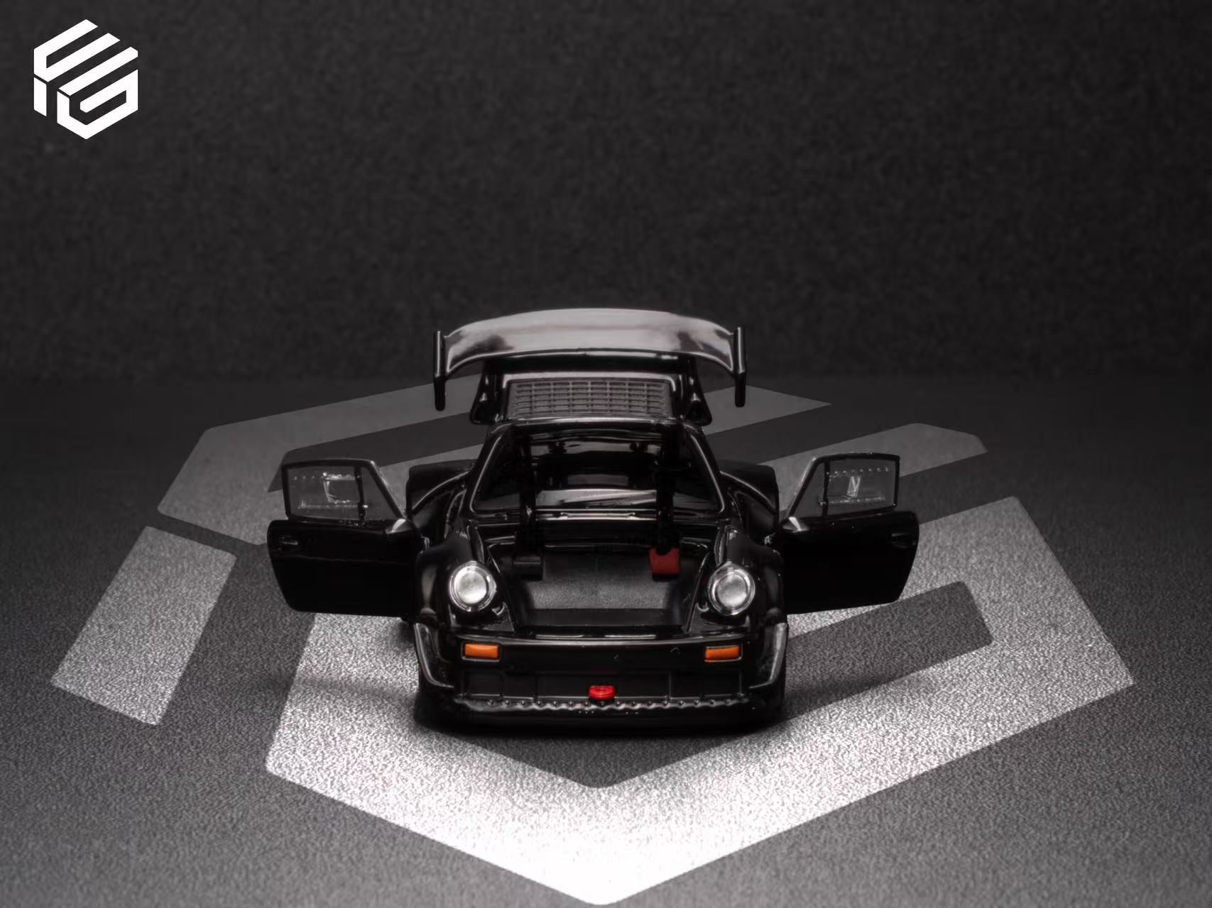 Model car with open doors on a dark background