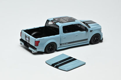 Light blue toy truck with black accents on a white background