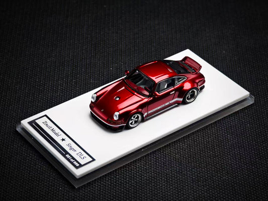 Red model car on a display stand with a dark background