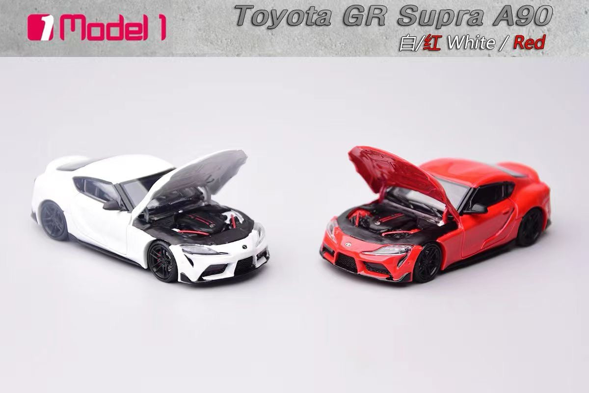 Two toy cars, one white and one red, with open hoods on a gray background.